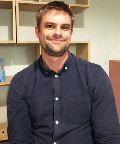 Portrait of Andrew Fisher, Board Member at the Happier Lives Institute