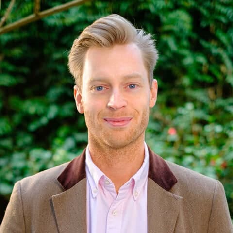 Headshot of Dr Michael Plant, Founder and Director at the Happier Lives Institute