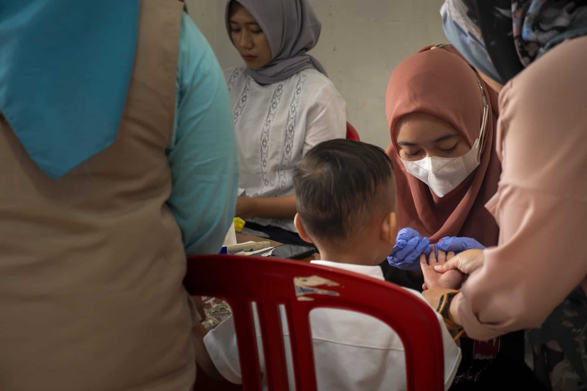Blood lead level testing on a young boy in Indonesia.