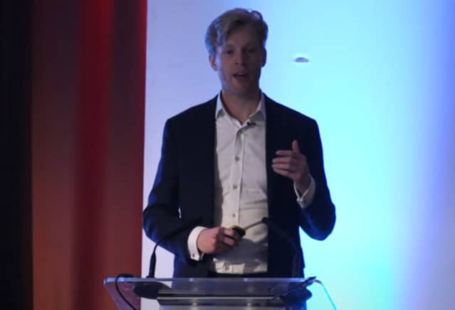 Dr Michael Plant giving a speech at a conference